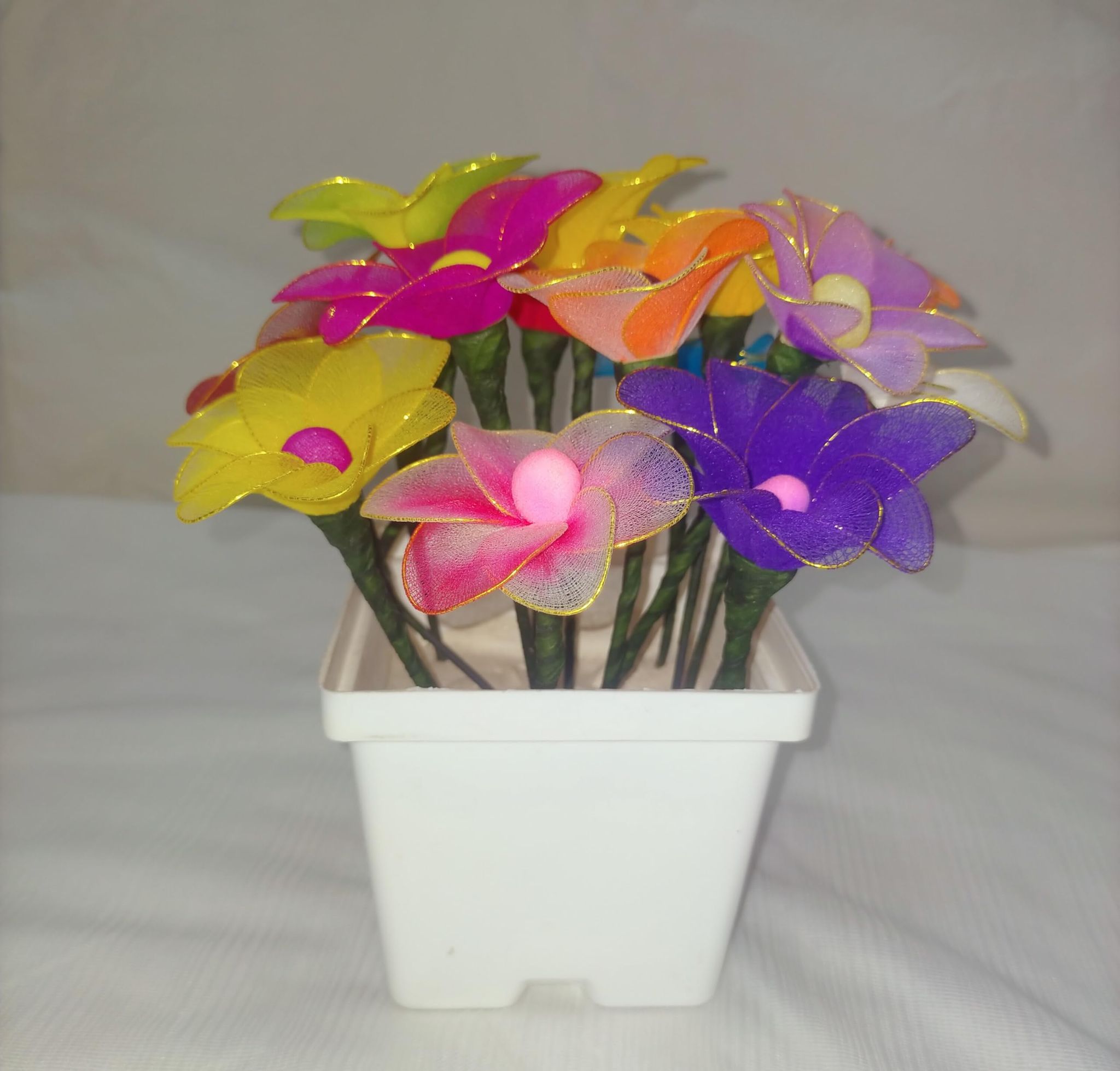 Nylon Multicolor Stocking Flowers (White Pot)