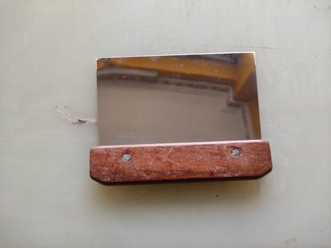 Red wooden scraper