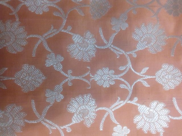 Festive shaded auspicious tinge abstract floral corsage style motif traditional look celebratory and bridal style party look fabric