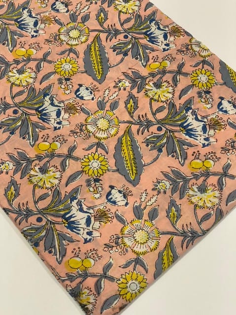 Peach colored fabric with flowers print
