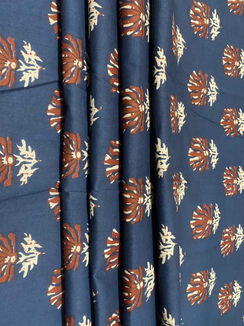 Blue colored cotton  fabric with red abstract lotuses print