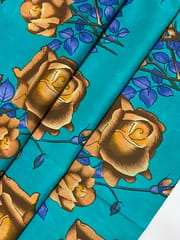 Light blue colored cotton fabric with brown flowers print