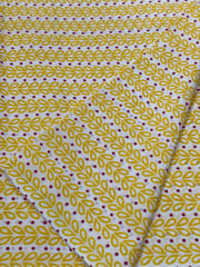 White base fabric with yellow leaves