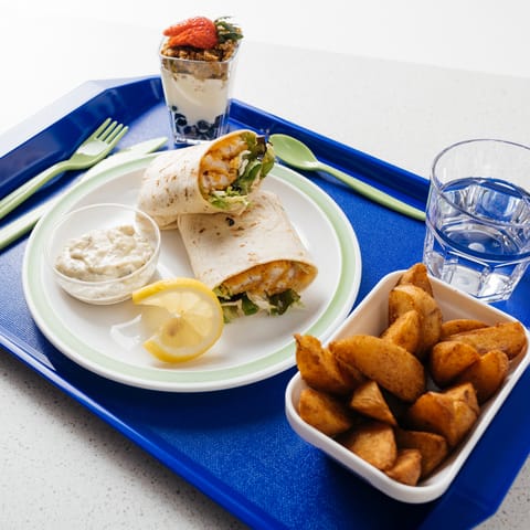 Chicken wraps served on a blue ABS tray