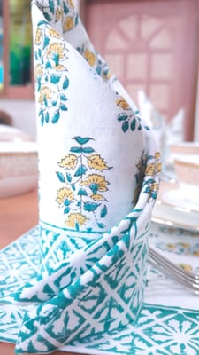 Green and white color organic cotton place mats, table runner and napkins set,, hand block printed in India with ethnic floral boota and border design.