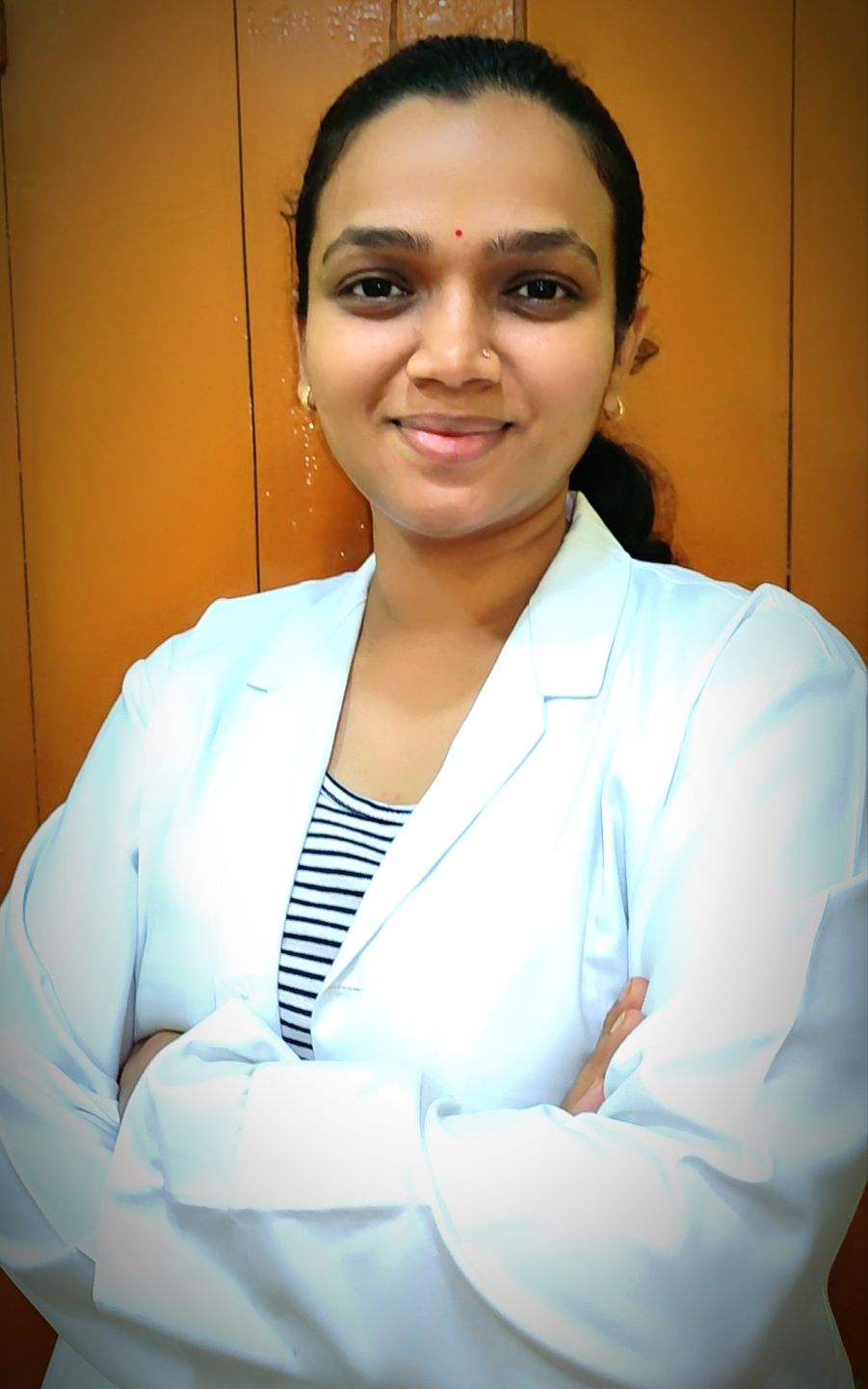 Dr. Veena Kamad (BAMS, MD)