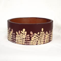 Grass in the wind on red wine ring planter