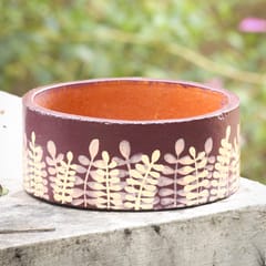 Grass in the wind on red wine ring planter