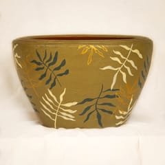 Shivering leaves on army green apple planter