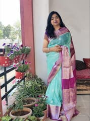 Pure Banarasi Chiffon Saree in Light Turquoise with contrast Rani Pink Border woven with Silver& Gold Zari