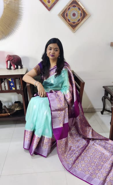 Pure Banarasi Chiffon Saree in Light Turquoise with contrast Rani Pink Border woven with Silver& Gold Zari