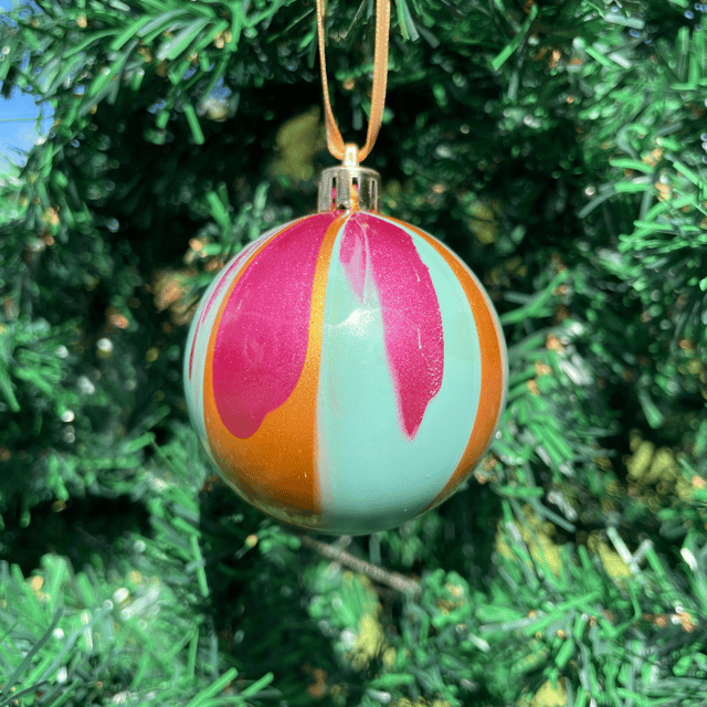 Raspberry, turquoise, and gold ornament