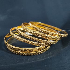 Golden Traditional Bangles In Bentex